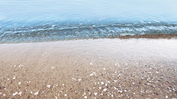 View of sea water and beach sand on sunny summer day — Stock Photo, Image