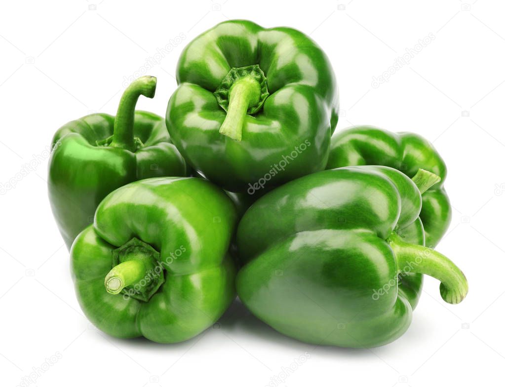 Pile of tasty green bell peppers on white background