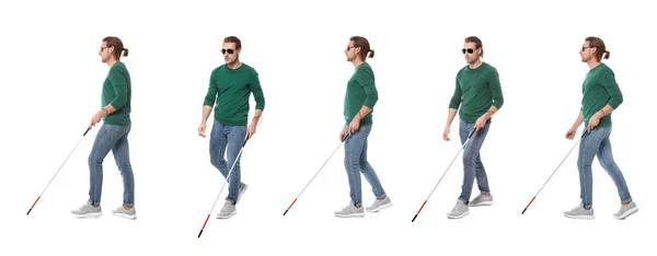 Набор молодых слепых мужчин с длинной тростью ходить на белом фоне — стоковое фото