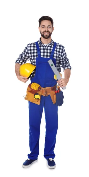 Full length portrait of construction worker with tool belt on white background — Stock Photo, Image