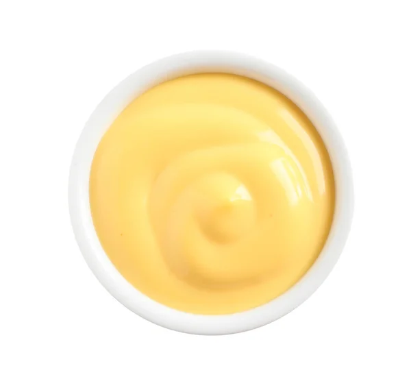 Deliciosa salsa de queso en un tazón sobre fondo blanco, vista superior — Foto de Stock