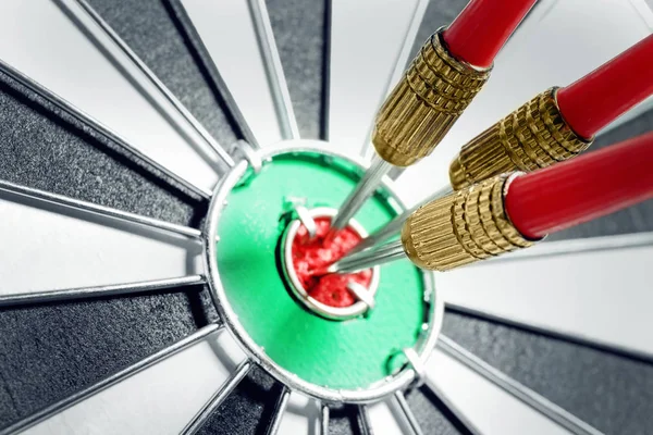 Dart board with red arrows hitting target, closeup — Stock Photo, Image