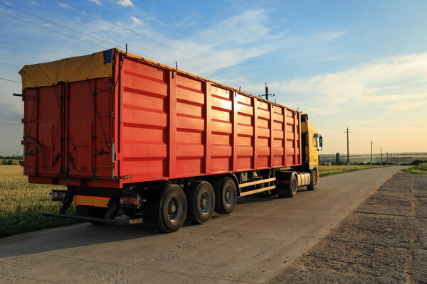 Modern bright truck parked on country road