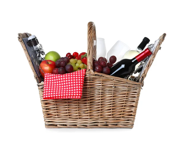 Wicker picnic basket with wine and different products on white background — Stock Photo, Image