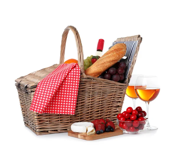 Wicker picnic basket with wine and different products on white background — Stock Photo, Image