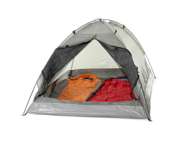 Comfortable grey camping tent with sleeping bags on white background — Stock Photo, Image