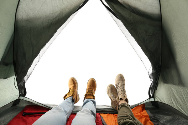 Closeup of couple in camping tent on white background, view from inside