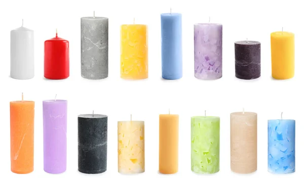 Conjunto com diferentes velas de cera decorativa no fundo branco — Fotografia de Stock