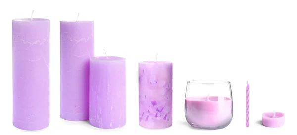 Conjunto com diferentes velas de cera no fundo branco — Fotografia de Stock