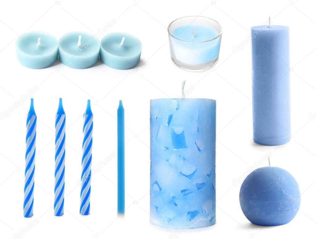 Set with decorative blue candles on white background