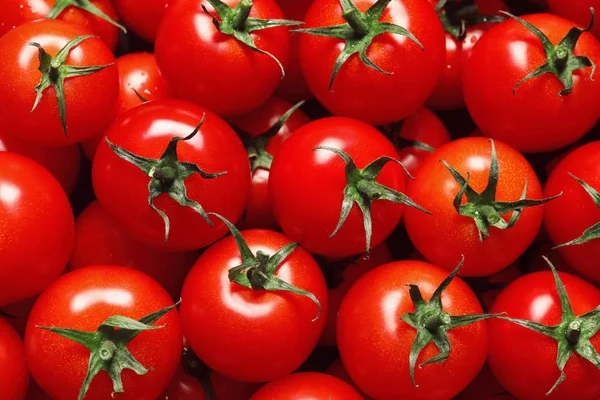 Heerlijke rijpe cherry tomaten als achtergrond, bovenaanzicht — Stockfoto