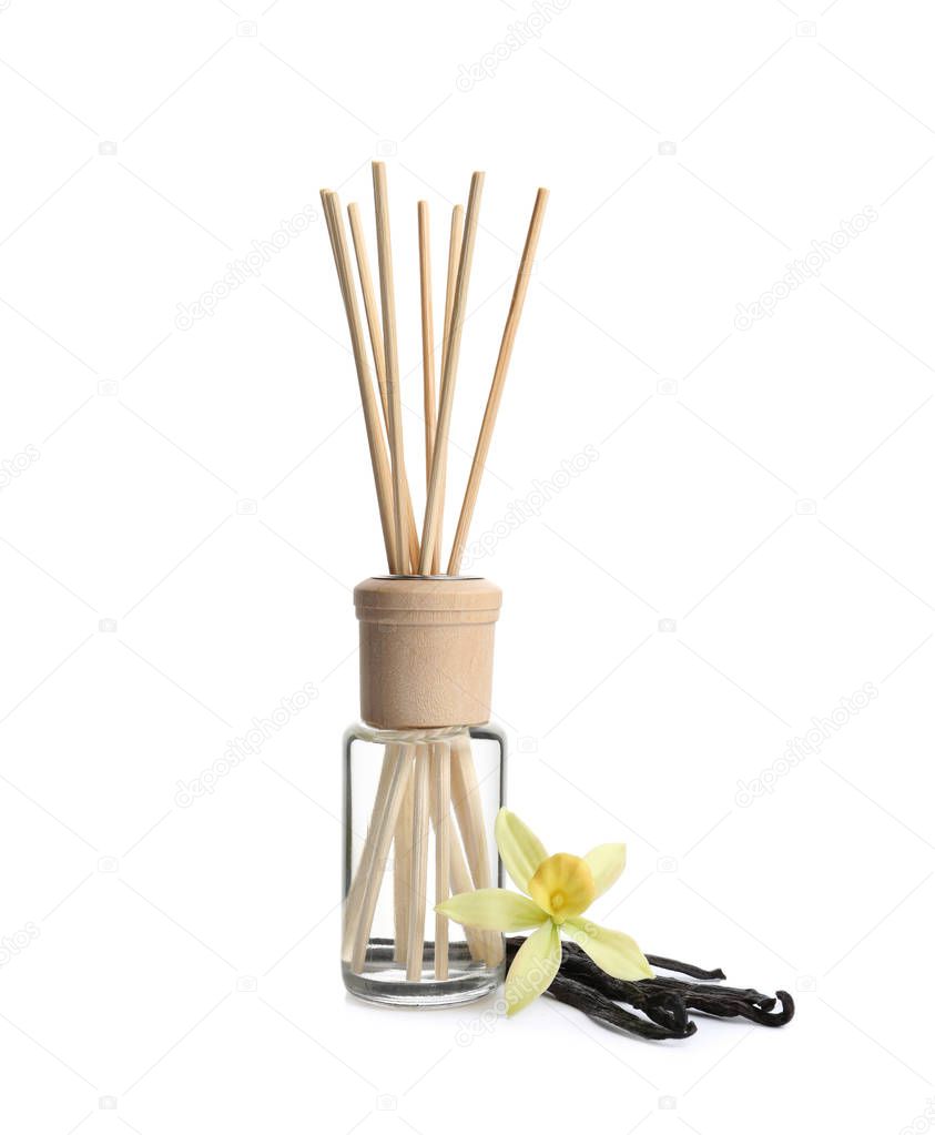 New reed air freshener, vanilla flower and beans on white background