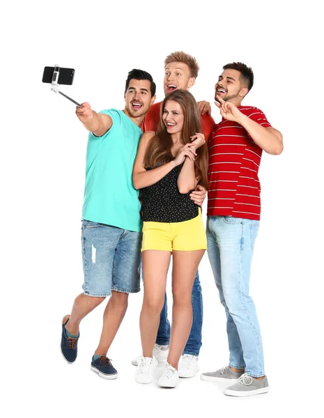 Glada ungdomar som tar selfie på vit bakgrund — Stockfoto