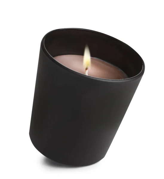 Aromatiskt brinnande ljus i svart hållare isolerad på vitt — Stockfoto