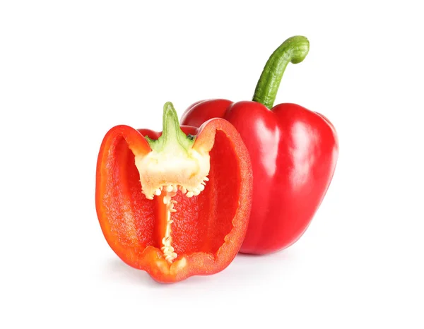 Cut and whole ripe red bell peppers on white background — Stock Photo, Image