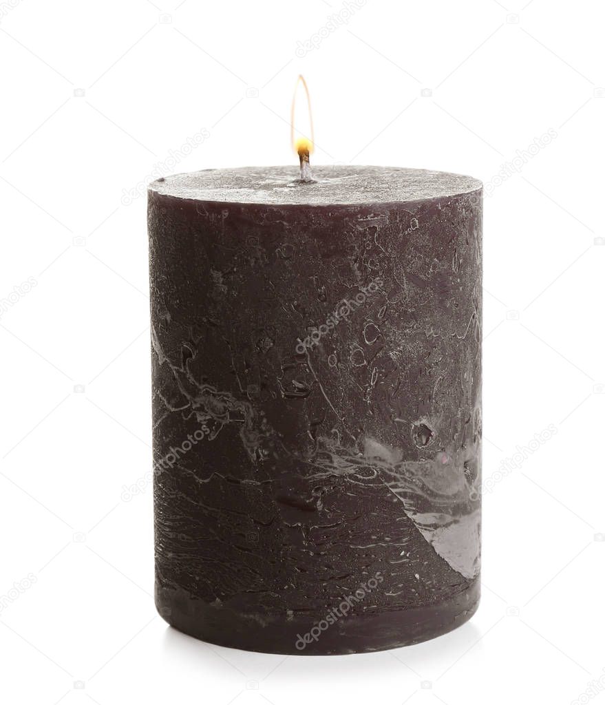 Dark burning decorative candle isolated on white
