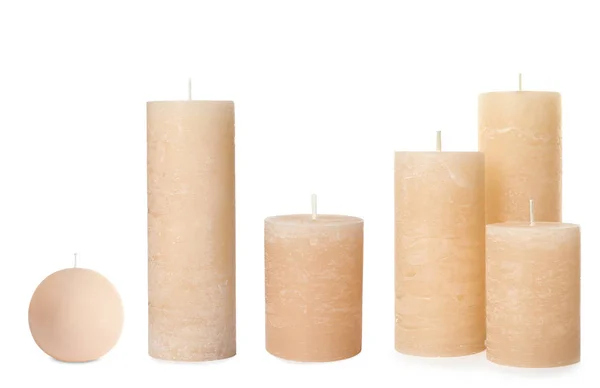 Set con velas de cera sobre fondo blanco — Foto de Stock
