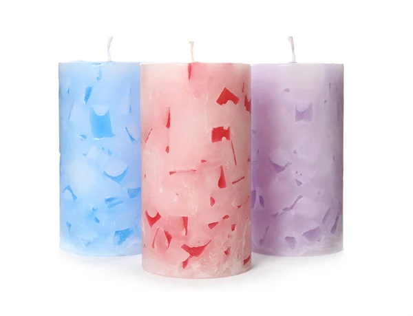 Tre candele di cera a colori su sfondo bianco — Foto Stock