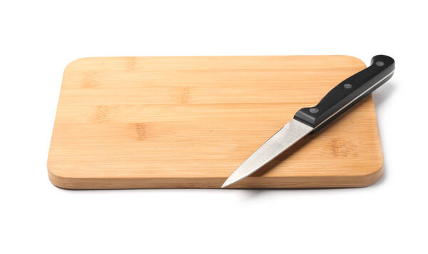 Paring knife and wooden board isolated on white