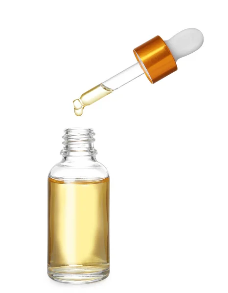 Bottle and pipette with essential oil on white background — Stock Photo, Image