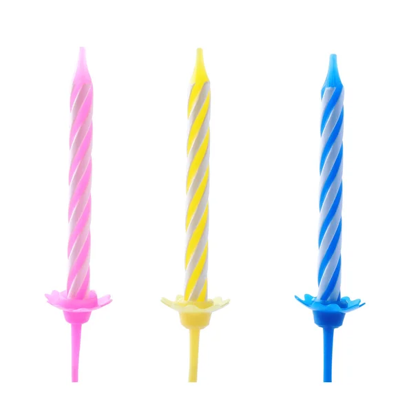 Barevné proužkované narozeninové svíčky v držáků izolovaných na bílém — Stock fotografie