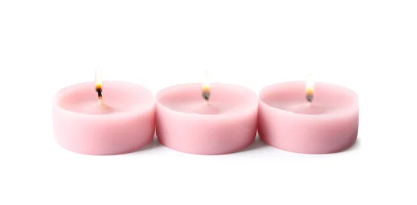 Velas decorativas de cera rosa aisladas en blanco —  Fotos de Stock