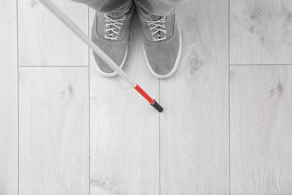 Blind person with long cane standing indoors, top view. Space for text — Stock Photo, Image