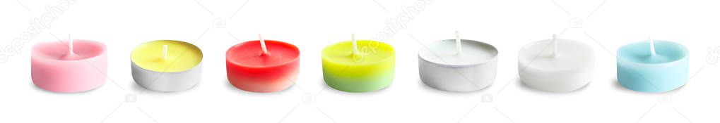 Set with different decorative wax candles on white background. Banner design 