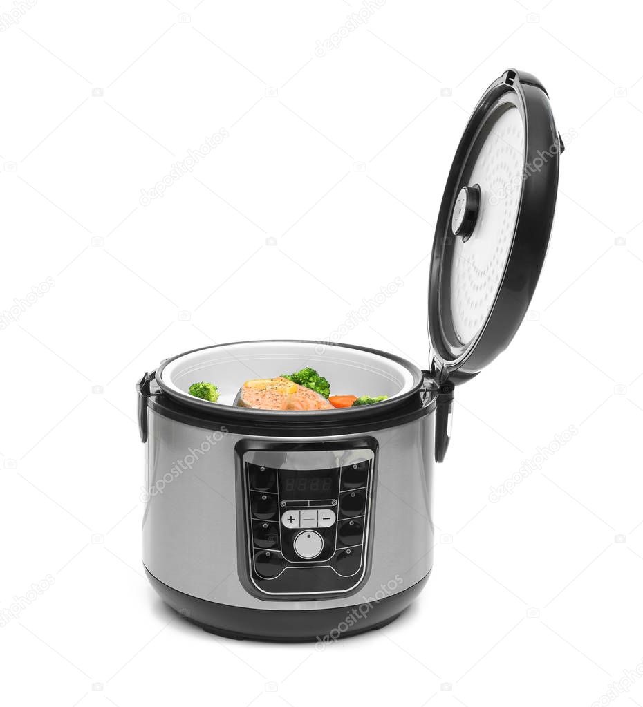 Modern multi cooker with fish and garnish on white background