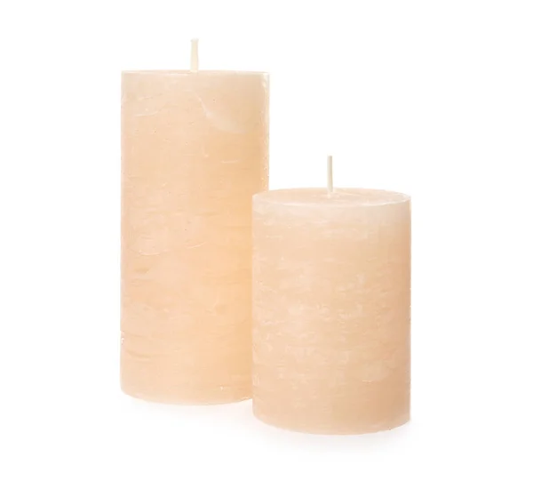 Dos velas de cera de color sobre fondo blanco — Foto de Stock