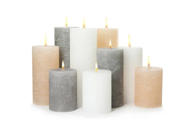 Many alight wax candles on white background — Stock Photo, Image