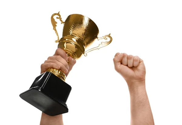 Young man holding gold trophy cup on white background, closeup — Stock Photo, Image