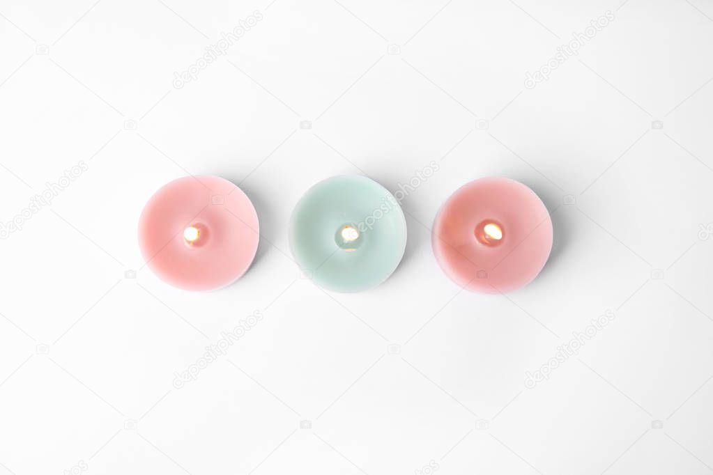 Color wax decorative candles isolated on white, top view