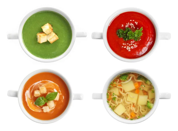 Set van verschillende verse zelfgemaakte soepen op witte achtergrond, bovenaanzicht — Stockfoto