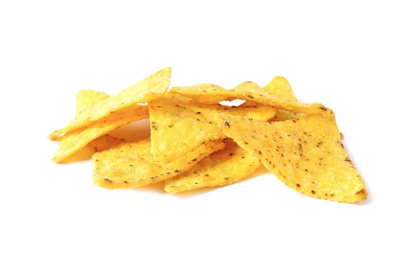 Egy halom ízletes mexikói nachos chipek fehér alapon — Stock Fotó