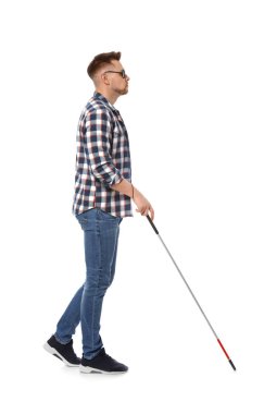Blind man in dark glasses with walking cane on white background clipart