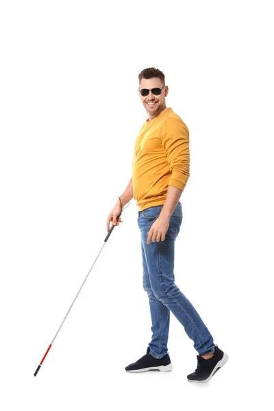 Blind man in dark glasses with walking cane on white background Stock Photo  by ©NewAfrica 290308320