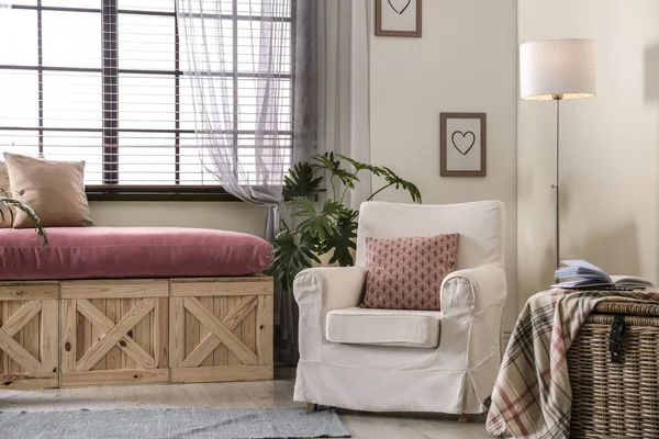 Elegant living room interior with comfortable armchair near window — Stock Photo, Image