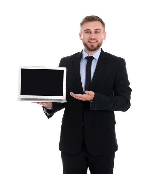 Happy young businessman holding laptop with empty screen on white background, space for text