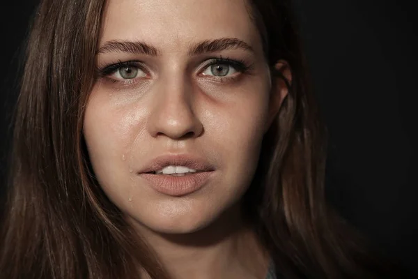 Crying young woman on dark background. Stop violence — Stock Photo, Image