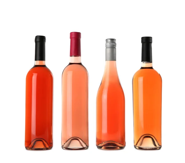 Garrafas de delicioso vinho rosa no fundo branco. Mockup para design — Fotografia de Stock