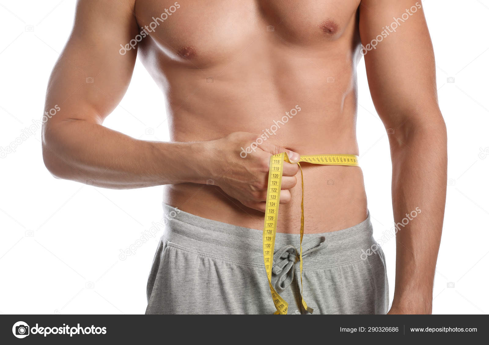 Young man with measuring tape showing his slim body on white background,  closeup Stock Photo by ©NewAfrica 272177214