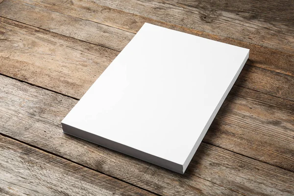 Stack of blank paper sheets for brochure on wooden background. Mock up — Stock Photo, Image