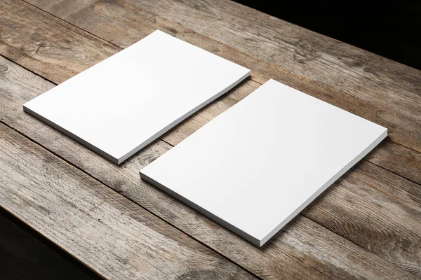 Blank paper sheets for brochure on wooden background. Mock up — Stock Photo, Image