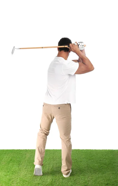 Young man playing golf on white background — Stock Photo, Image