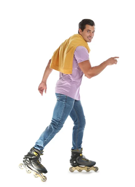 Schöner junger Mann mit Inline-Rollschuhen auf weißem Hintergrund — Stockfoto