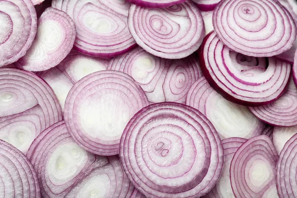 Cut fresh red onions as background, top view Stock Picture