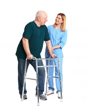 Caretaker helping elderly man with walking frame on white background clipart