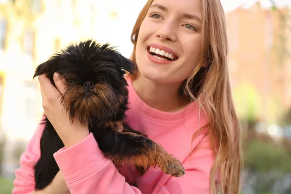 Young woman with adorable Brussels Griffon dog outdoors — Stock Photo, Image