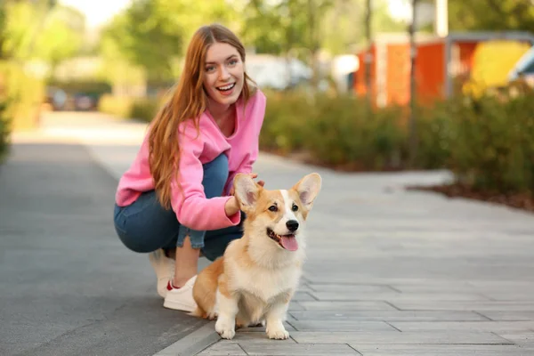 Young woman with her adorable Pembroke Welsh Corgi dog in park — Stock Photo, Image